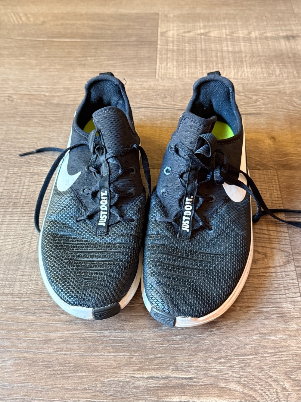 Nike Woman’s Black Athletic Running Shoes with White Swoosh